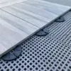 SkyWalk Porcelain Roof Pavers on Fall Protection Grates Using 1/4" Stackable Rubber Pedestal SD-00