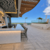 Rooftop Bar and Seating Area on OneGT Hotel with porcelain pavers on pedestals in Grand Cayman Island by Skydeck USA