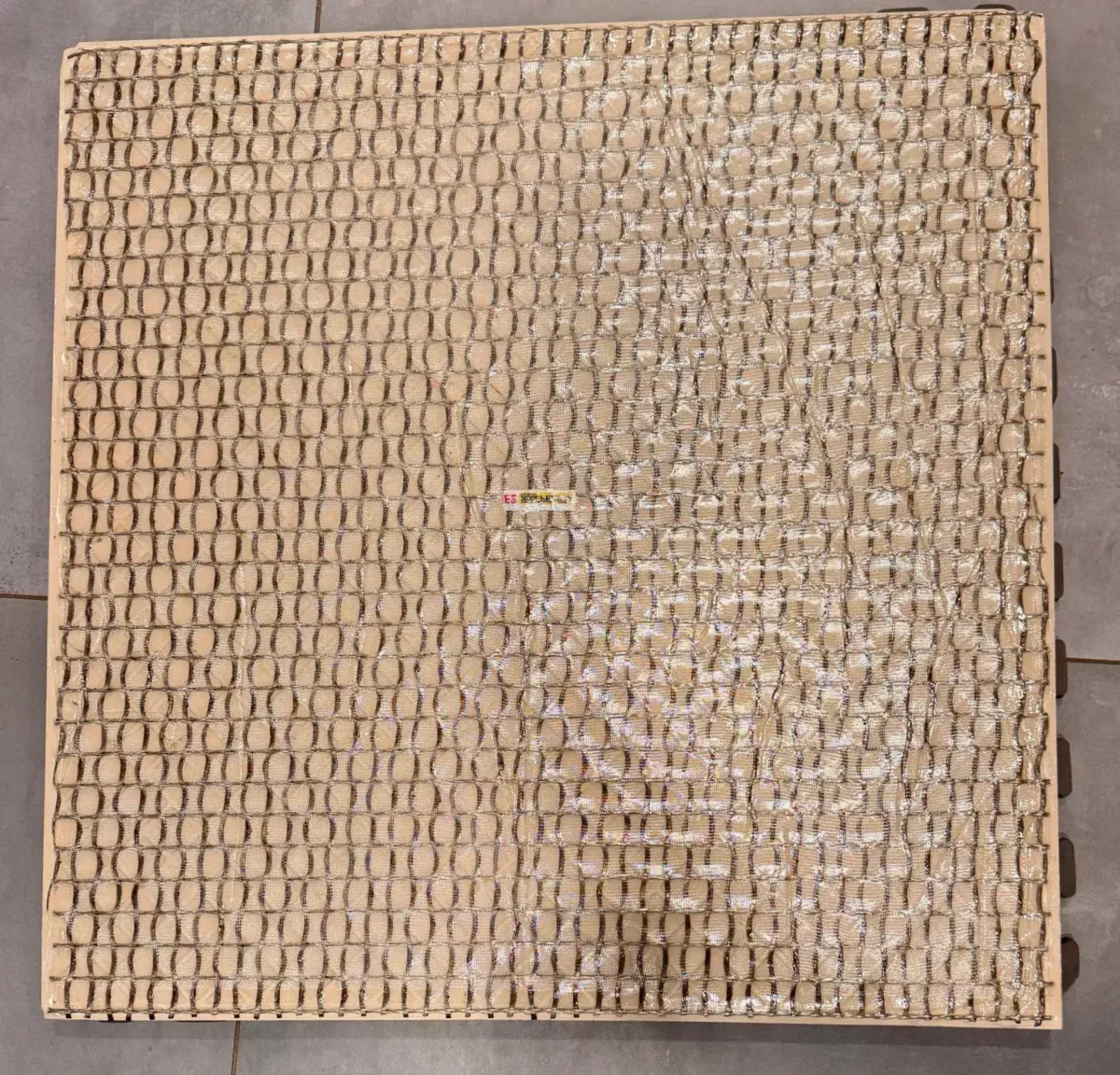 Factory applied, integrated safety backing for 2cm porcelain pavers; fall protection for porcelain pavers by skydeck usa.