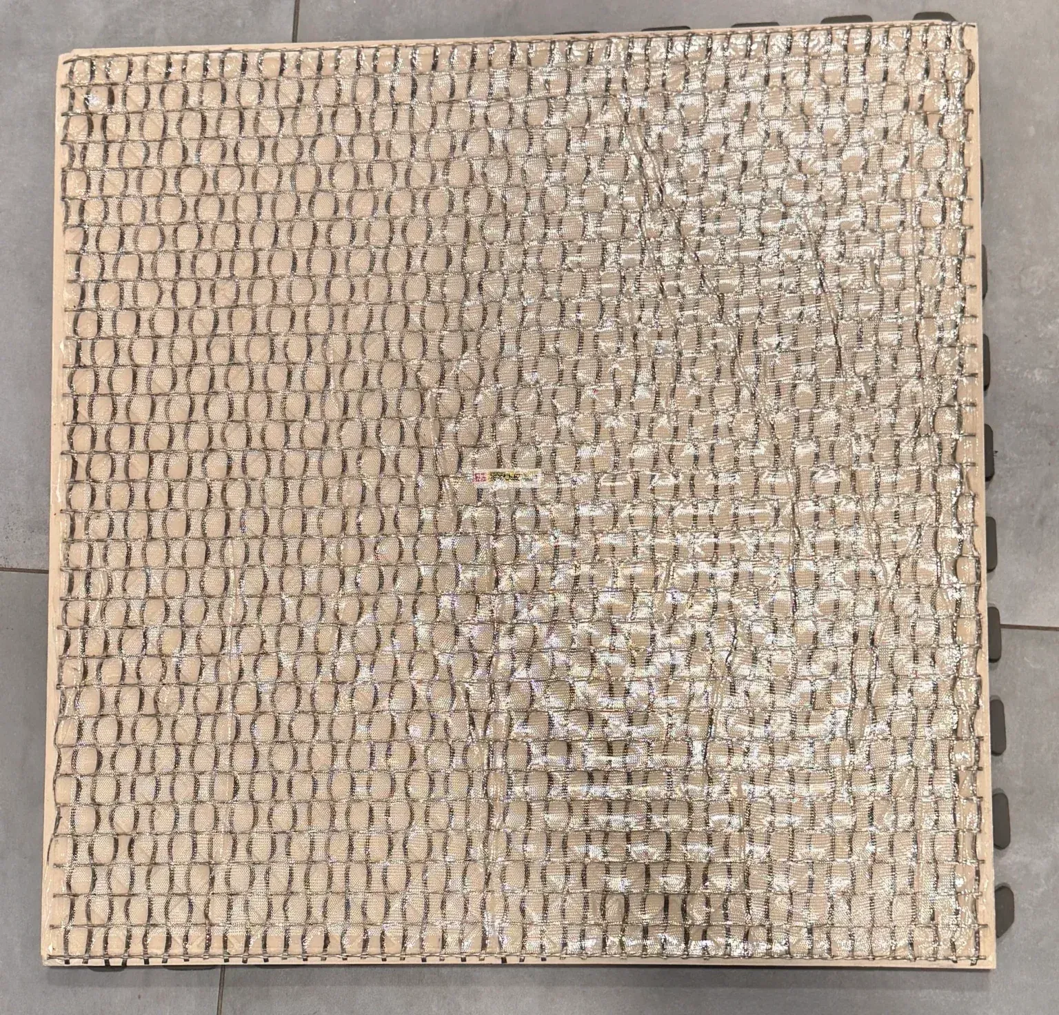 Pre-Installed Porcelain Paver Safety Backing; factory applied fall protection for porcelain pavers by skydeck usa.