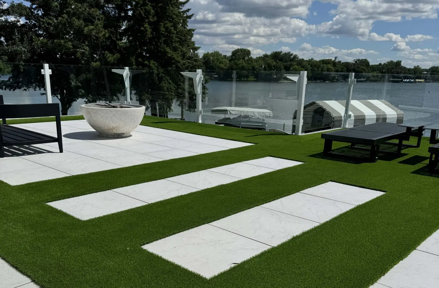 Lake Minnetonka rooftop deck using SkyWalk Porcelain Pavers, Turf on Grates and SkyJack Pedestal Pavers