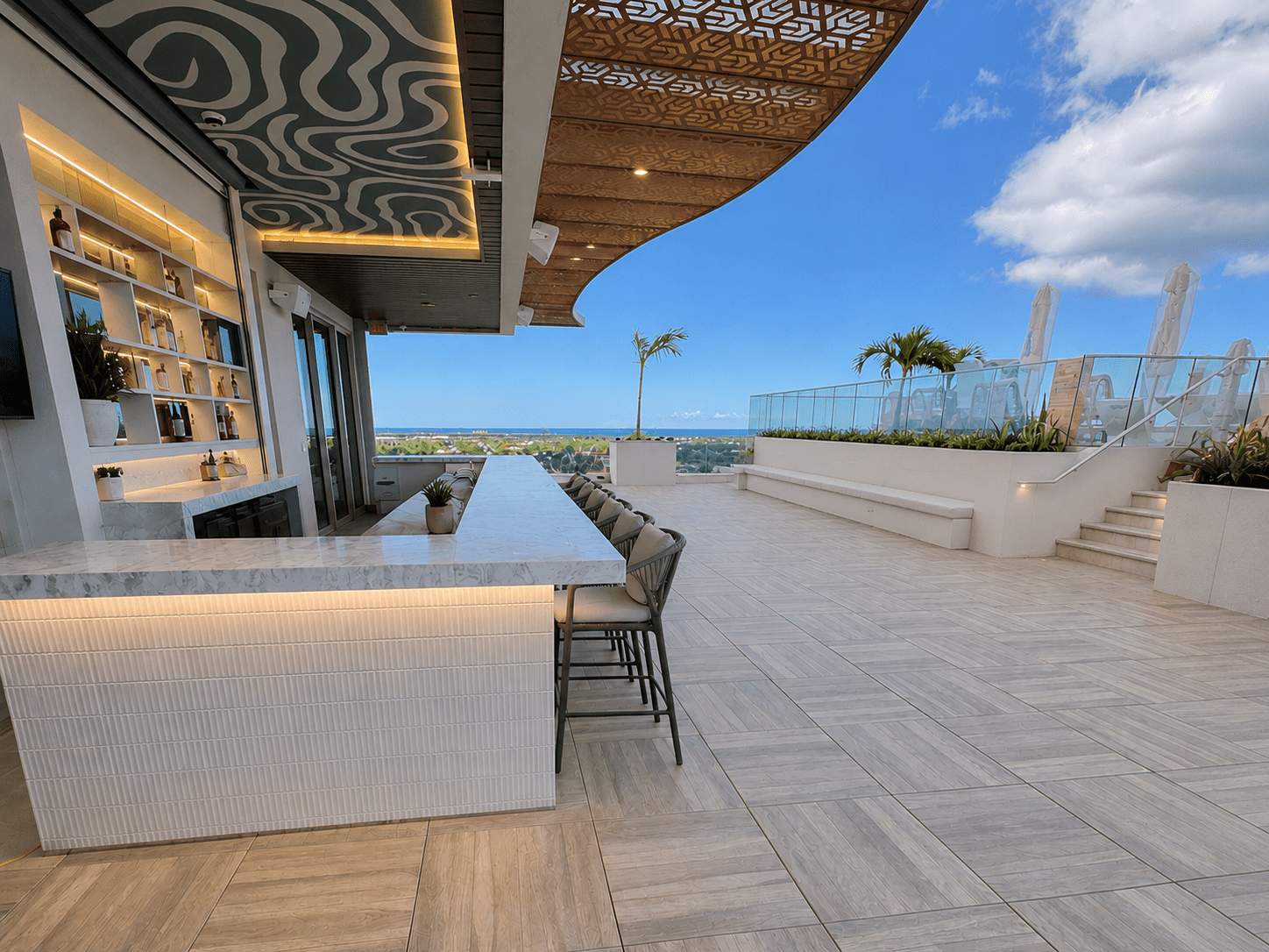 Rooftop Bar and Seating Area on OneGT Hotel with porcelain pavers on pedestals in Grand Cayman Island by Skydeck USA