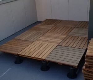 Ipe Deck Project In Process Colored concrete patio pavers on a customer's deck in Wyoming, MI