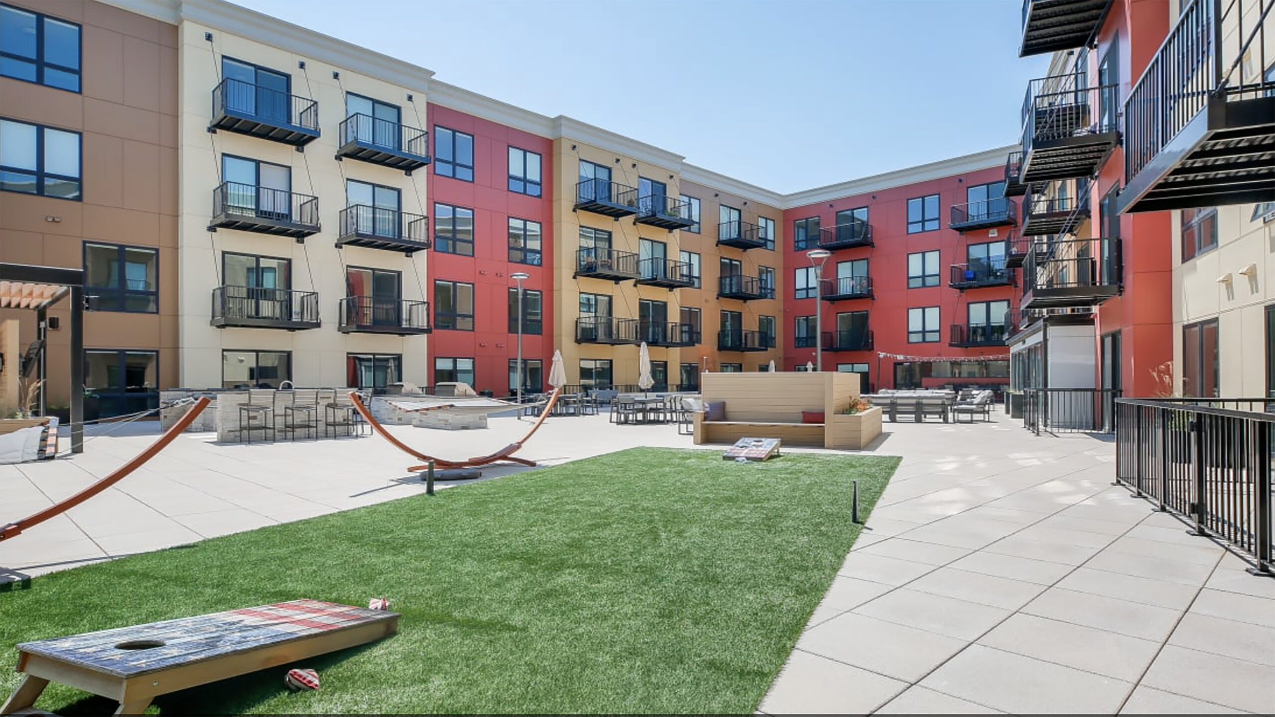 The Hub Apartments - University of Illinois Champaign - Turf and Concrete Pavers The Hub Apartments - University of Illinois Champaign - Sentry Roofing - US Pedestal Systems - Turf and Concrete Pavers 2