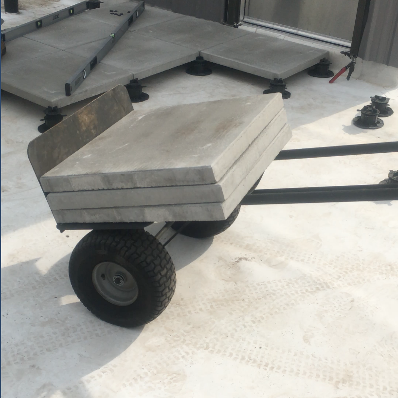 Moving roof pavers with a furniture dolly